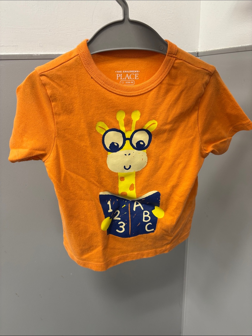 The Children's Place Orange Giraffe Reading Tee with Blue Book